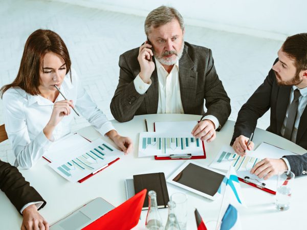 The business people working together at table. The meeting or summit concept